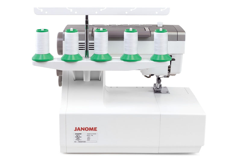Janome CoverPro 3000P professional cover hem machine front view showing the extra long bed and thread cones.