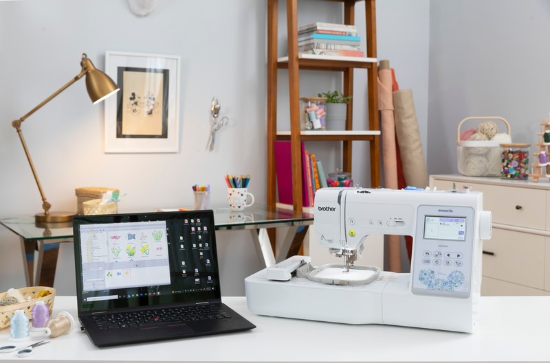 brother-innov-is-ns1850d-combo-sewing-embroidery-machine-with-black-laptop-on-white-craft-desk