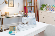 brother-innov-is-ns1850d-combo-sewing-embroidery-machine-displayed-on-table-with-hard-case-wide-table-and-included-accessories