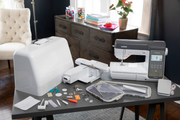 brother-innov-is-ns2850d-combo-sewing-embroidery-machine-displayed-on-table-with-hard-case-hoops-and-included-accessories
