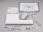 brother-pq1600s-high-speed-straight-stitch-sewing-quilting-machine-included-accessories-and-operation-manual-flat-lay-view