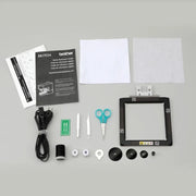 overhead-view-brother-skitch-pp1-unboxing-accessories-including-magnetic-hoop-scissors-and-quick-reference-guide
