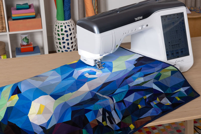 high-angle-view-brother-celeste-innov-is-cx1-sewing-machine-quilting-blue-geometric-pattern-fabric
