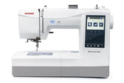 Janome Memory Craft 100E computerized embroidery machine front view showing color touchscreen.