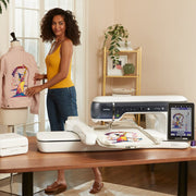 A designer working with fabric alongside the luxury Brother Aveneer EV1-LE limited edition sewing quilting and embroidery machine
