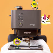 brother-skitch-pp1-single-needle-embroidery-machine-front-view-with-whimsical-cartoon-graphics