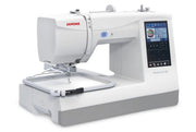 Janome Memory Craft 100E computerized embroidery machine front view showing color touchscreen.