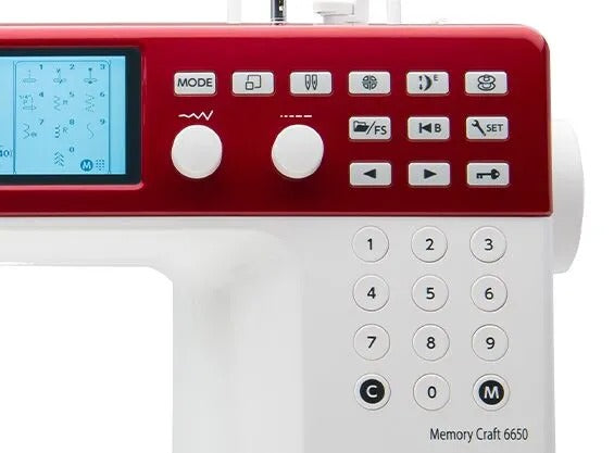 Janome Memory Craft 6650 computerized flatbed sewing and quilting machine