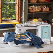 The Brother Stellaire Innov-is XJ2 setup with its heavy-duty embroidery unit and large project hoop attached