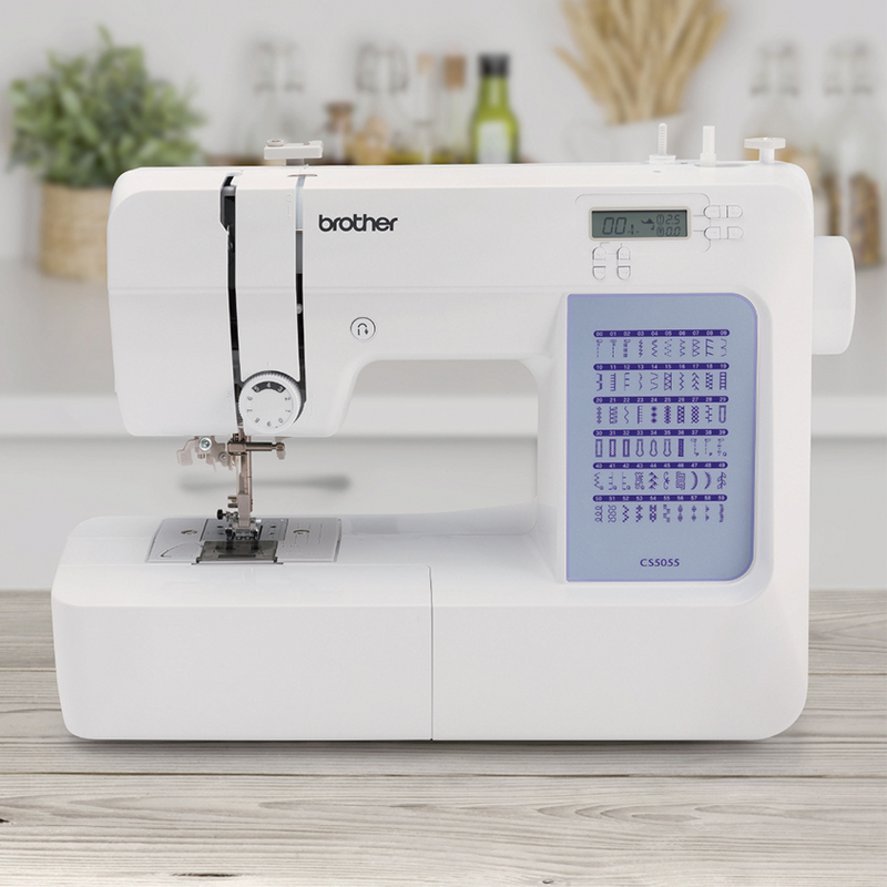 brother-cs5055-computerized-sewing-machine-front-view-focused-with-blurred-kitchen-background