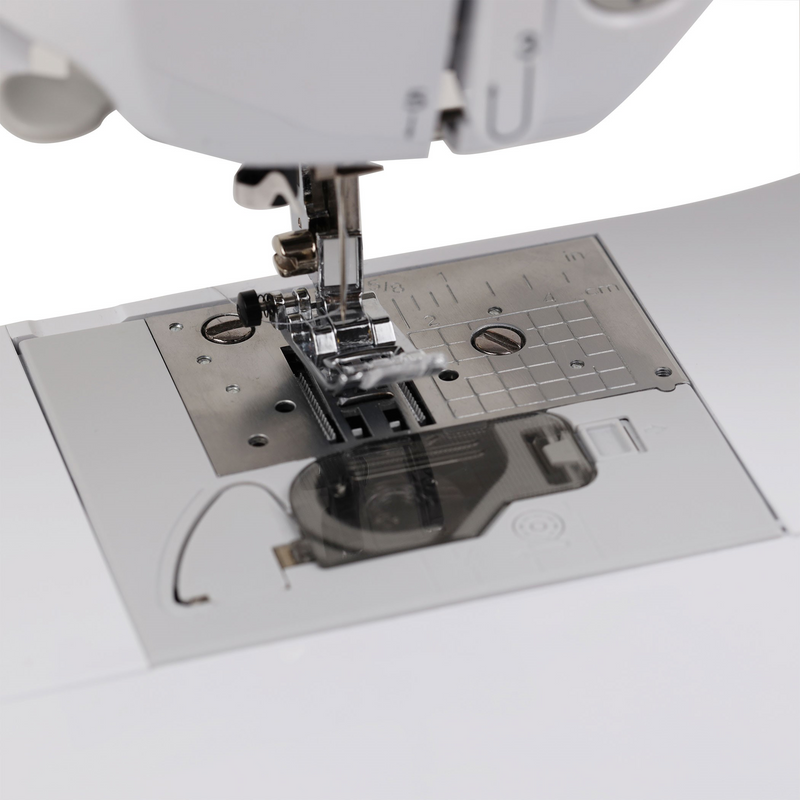 brother-st150hdh-strong-and-tough-computerized-sewing-machine-close-up-needle-plate-and-7-point-feed-dogs-view