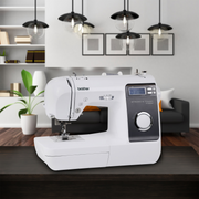 brother-st150hdh-strong-and-tough-computerized-sewing-machine-on-dark-wooden-table-living-room-lifestyle-view