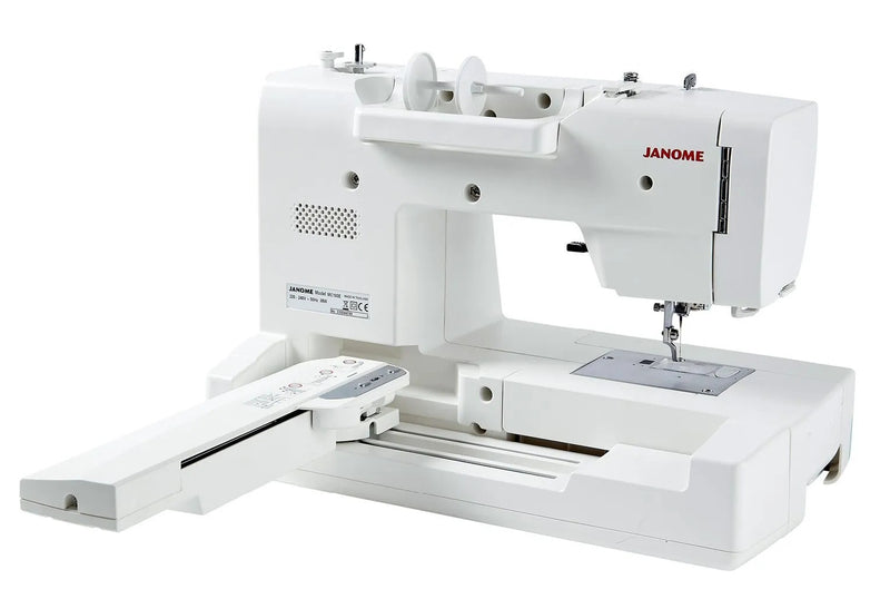 Janome Memory Craft 100E computerized embroidery machine front view showing color touchscreen.