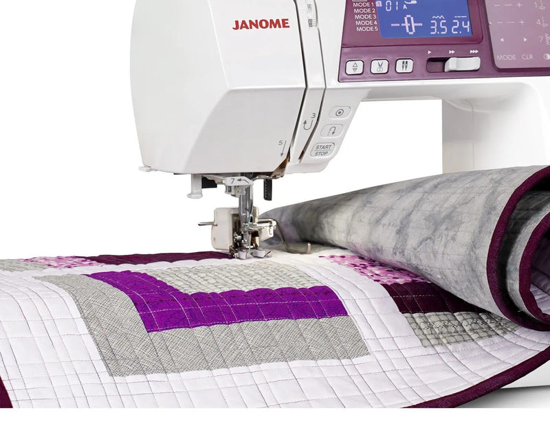 Janome 5300QDC-G computerized sewing and quilting machine in grapevine purple front view.