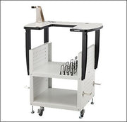 The Brother PRNSTD2 heavy duty multi needle stand fully assembled with a machine attached showcasing lower storage shelves and locking casters