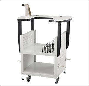 The Brother PRNSTD2 heavy duty multi needle stand fully assembled with a machine attached showcasing lower storage shelves and locking casters