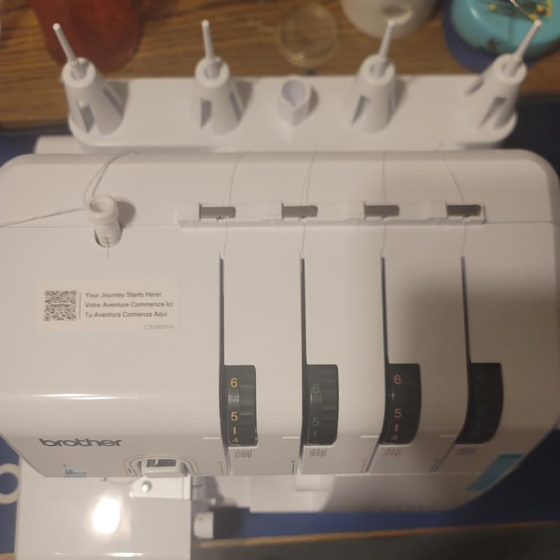 overhead-close-up-thread-tension-dials-and-threading-channels-on-top-panel-of-brother-airflow-3000-air-serger