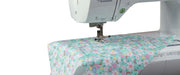 close-up-needle-stitching-floral-patterned-fabric-on-brother-pacesetter-innov-is-ps500-sewing-machine