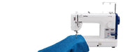 brother-pq1600s-high-speed-straight-stitch-sewing-quilting-machine-feeding-blue-denim-fabric-view