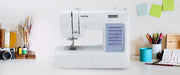 brother-cs5055-computerized-sewing-machine-lifestyle-view-on-white-craft-desk-with-art-supplies