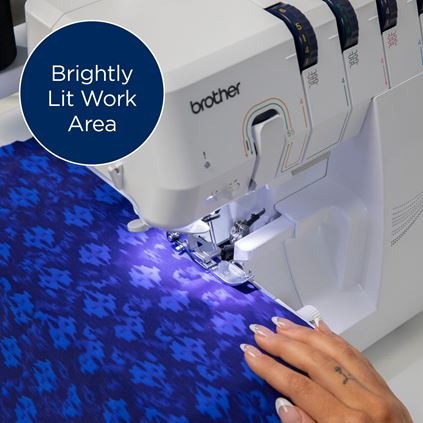 brother-air1800-air-serger-front-view-on-white-table-with-foot-pedal-and-included-accessories