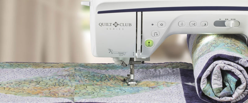 close-up-needle-and-presser-foot-stitching-detailed-patterned-quilt-on-brother-innov-is-bq1350-sewing-machine