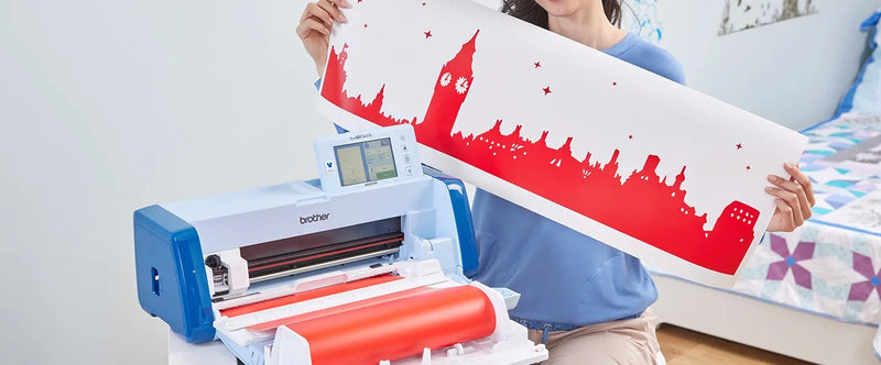 woman-holding-skyline-cutout-next-to-brother-scanncut-dx-innov-is-edition-sdx330d-disney-electronic-cutting-machine