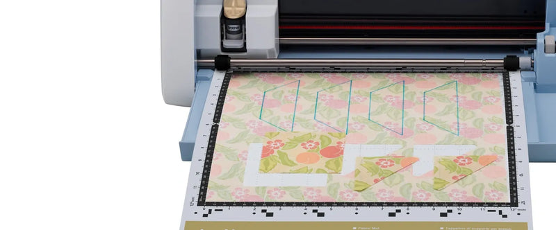 close-up-inserted-fabric-mat-showing-precise-quilt-pattern-cutouts-on-brother-scanncut-dx-innov-is-edition-sdx325