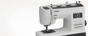 brother-st371hd-strong-and-tough-sewing-machine-close-up-front-angled-view-focusing-on-stitch-selection-chart