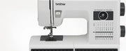 brother-st371hd-strong-and-tough-sewing-machine-close-up-straight-front-view-focusing-on-needle-and-control-panel