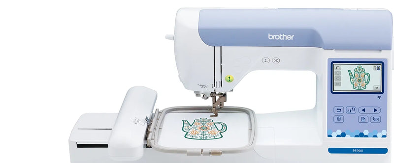close-up-embroidery-hoop-stitching-teapot-design-on-white-fabric-with-brother-pe900-machine