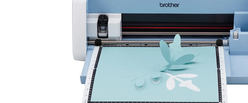 close-up-inserted-standard-tack-mat-showing-precise-light-blue-paper-leaf-cutouts-on-brother-scanncut-dx-sdx325