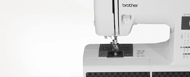brother-st371hd-strong-and-tough-sewing-machine-close-up-left-side-angled-view-focusing-on-needle-and-drop-in-bobbin