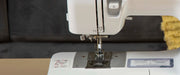 close-up-needle-and-presser-foot-aligned-above-needle-plate-on-brother-pacesetter-ps200t-sewing-machine