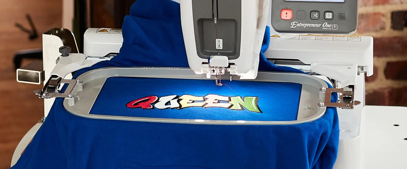 brother-entrepreneur-one-pr1x-single-needle-embroidery-machine-stitching-queen-logo-on-blue-hoodie