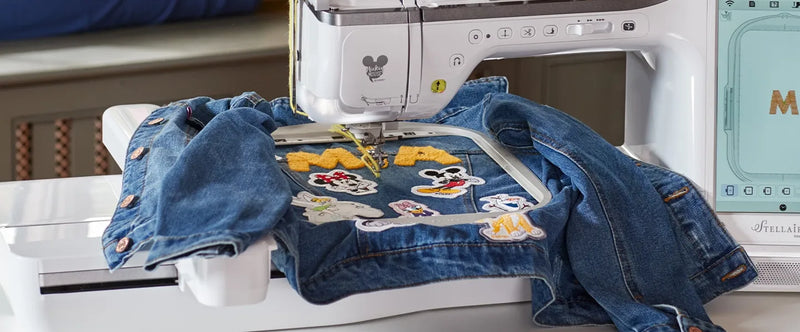 close-up-embroidery-hoop-brother-stellaire-innov-is-xe2-stitching-custom-disney-patches-on-denim-jacket