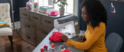 lifestyle-view-of-woman-sewing-red-polka-dot-fabric-with-brother-innov-is-ns2850d-combo-sewing-embroidery-machine