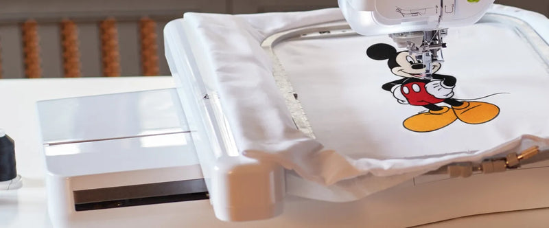 close-up-hoop-brother-stellaire-innov-is-xe2-embroidery-machine-stitching-mickey-mouse-design