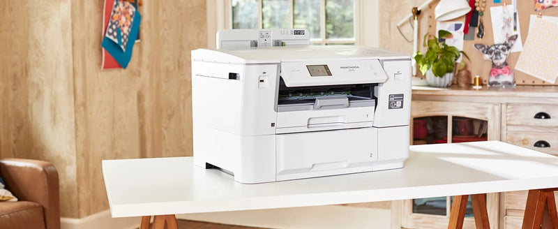 brother-printmoda-studio-fabric-printer-hl-jf1-on-white-craft-table-front-angle-view
