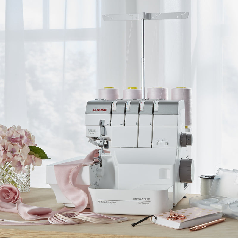 Janome AirThread 2000D Professional overlocker shown fully assembled with the included extra-wide extension table attached.
