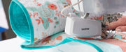 close-up-compact-muvit-digital-dual-feed-foot-attachment-guiding-floral-quilt-on-brother-innov-is-bq2500