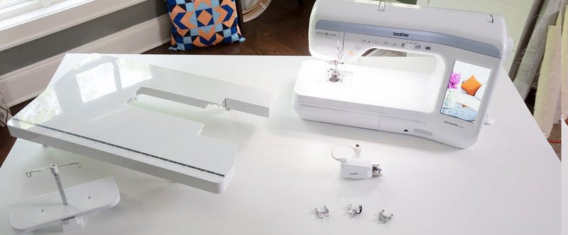 brother-innov-is-bq2500-sewing-machine-on-white-table-with-unboxed-quilters-bundle-accessories-kit-spread
