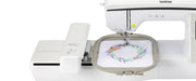 close-up-embroidery-hoop-and-needle-mechanism-stitching-floral-wreath-design-on-brother-innov-is-nq1700e-embroidery-machine