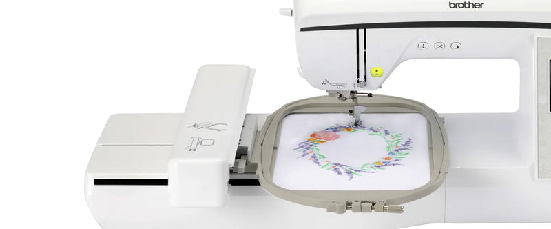 close-up-embroidery-hoop-and-needle-mechanism-stitching-floral-wreath-design-on-brother-innov-is-nq1700e-embroidery-machine