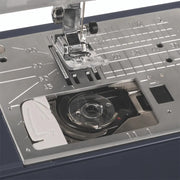 anome TravelMate 50 computerized sewing and quilting machine front view displaying control panel buttons.