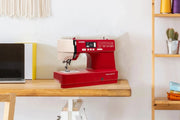 Janome TravelMate 30 computerized portable sewing machine front view showcasing stitch options and control sliders.