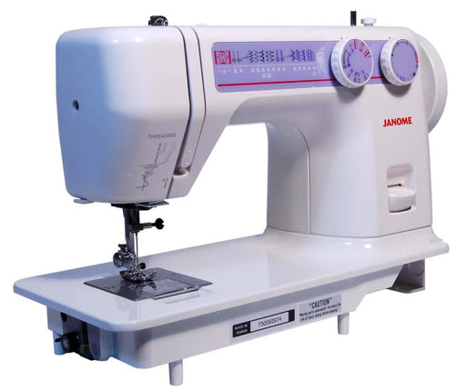 Janome 712T non-electric treadle sewing machine front view showcasing the oversized handwheel and flatbed design.