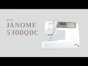 Janome 5300QDC-G computerized sewing and quilting machine in grapevine purple front view.