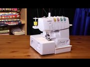 brother-1034d-serger-front-view-showing-color-coded-thread-guides-and-four-blue-spools