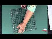 Creative Grids CGR12 twelve and a half inch square acrylic quilt ruler with black and white grid markings.